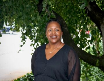 Ronsha Dickerson posing for a photo outside underneath a tree