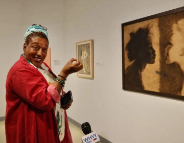 CCH Pounder speaks in front of an artwork