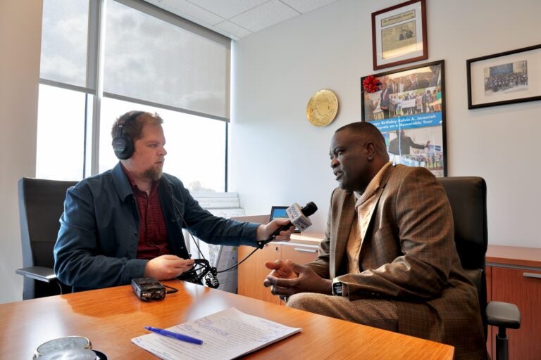 WHYY reporter Aarron Moselle interviews Philadelphia Housing Authority President Kelvin Jeremiah