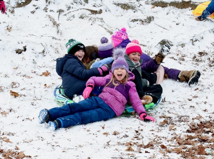 2025 01 06-e lee- moorestown nj-snow day sledders A group of children playing in the snow on sleds