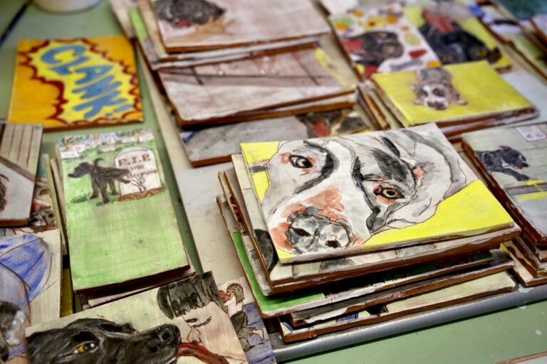 A table ful of artwork from the book