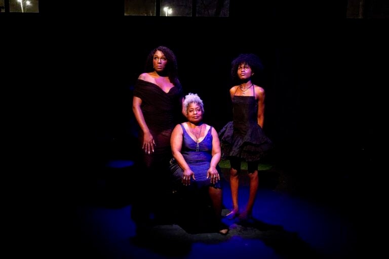 Janelle Luster, Pamela A. Hooks and Nikki Edwards look on