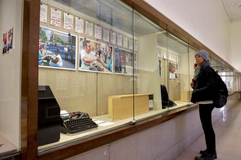 Photos and typewriters are shown in a display