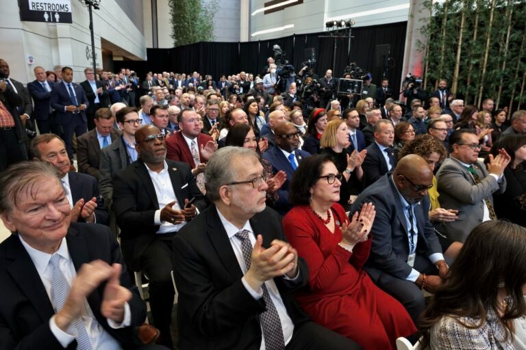 an audience claps in the Roberts Pavilion