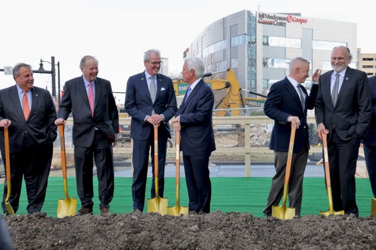 Chris Christie, Tom Kean, Phil Murphy, George Norcross, Jim McGreevey and Jon Corzine hold shovels