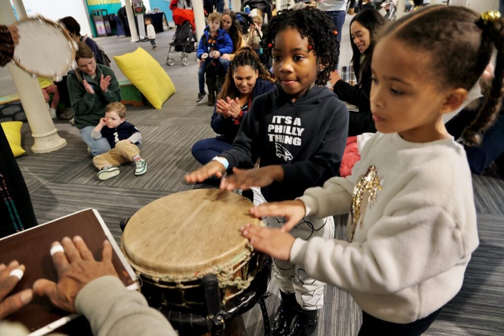 Children playing the hand drums