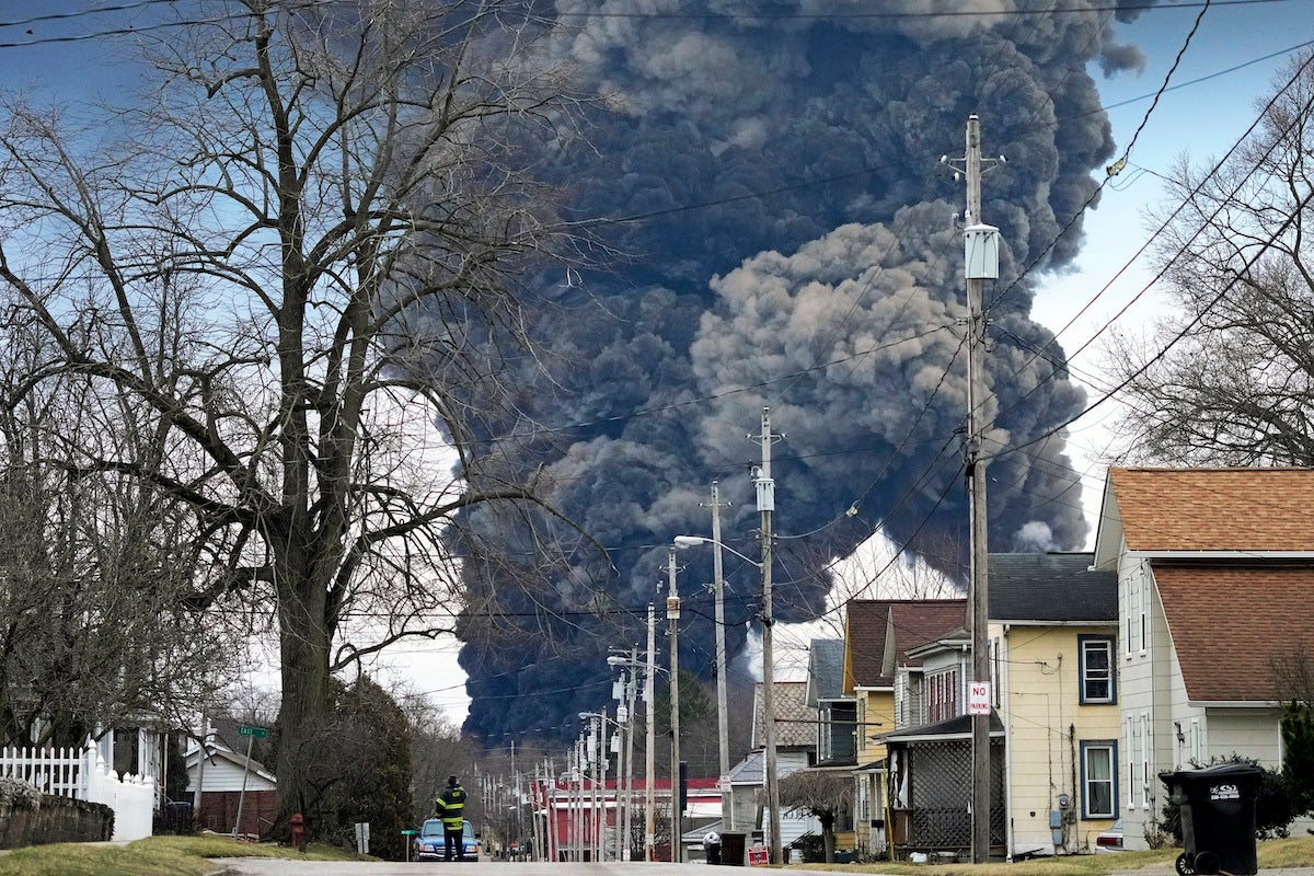 A black plume rises over East Palestine, Ohio, as a result of the controlled detonation of a portion of the derailed Norfolk Southern trains Monday, Feb. 6, 2023. (AP Photo/Gene J. Puskar, File)