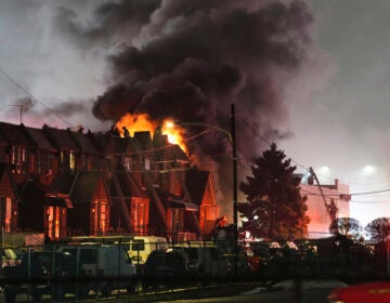 First responders work the scene after a small plane crashed in Philadelphia, Friday, Jan. 31, 2025. (AP Photo/Matt Rourke)