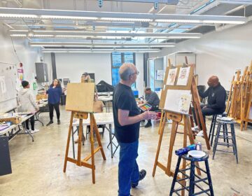 veterans painting in a studio