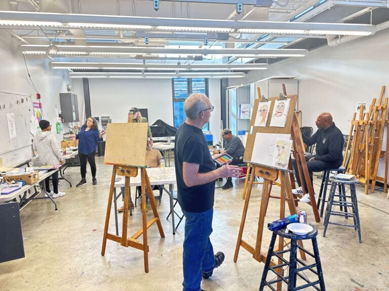 veterans painting in a studio