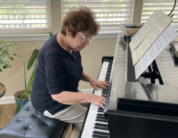 Ena Barton plays piano