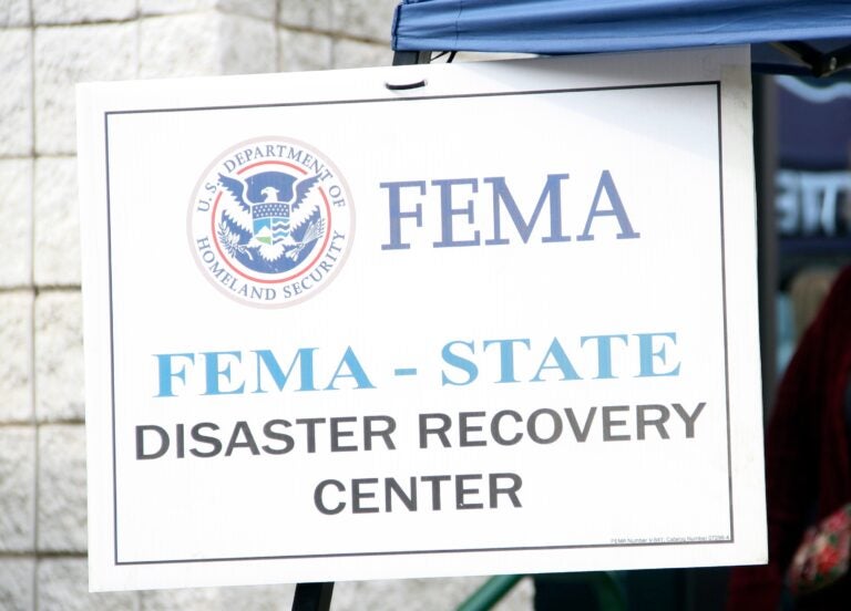 a sign reads FEMA - STATE DISASTER RECOVERY CENTER