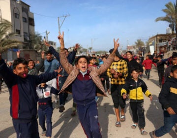 Children cheering in the street