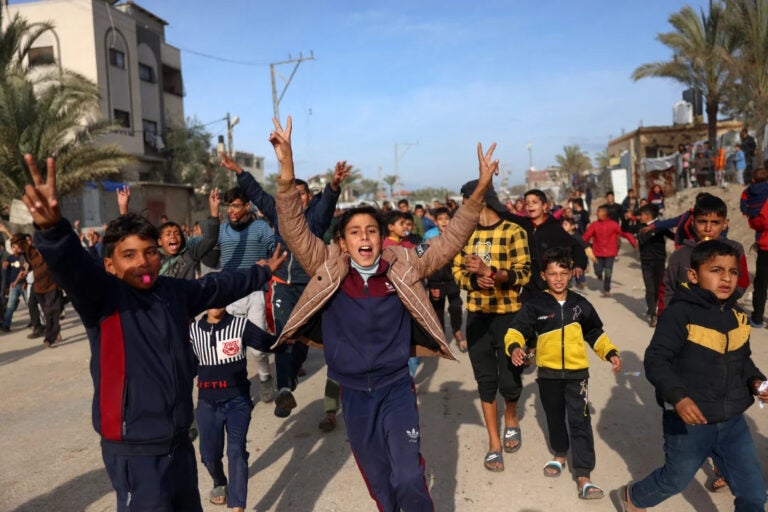 Children cheering in the street