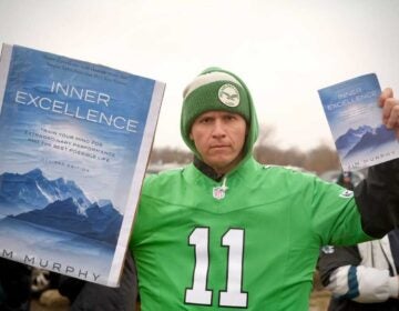 Gabe Mahalik (dj_gabereal) with a copy of 'Inner Excellence', which went viral when Philadelphia Eagles wide receiver AJ Brown was seen reading it on the sidelines of a game.