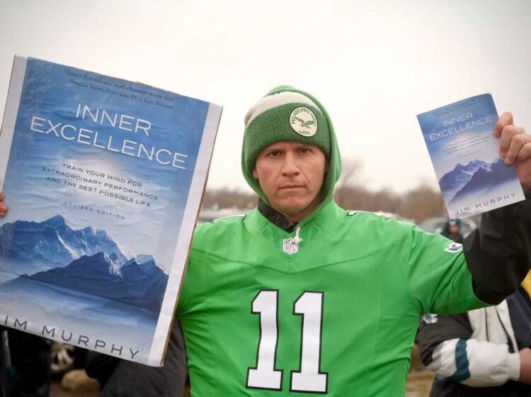 Gabe Mahalik (dj_gabereal) with a copy of 'Inner Excellence', which went viral when Philadelphia Eagles wide receiver AJ Brown was seen reading it on the sidelines of a game.