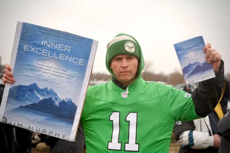 Gabe Mahalik (dj_gabereal) with a copy of 'Inner Excellence', which went viral when Philadelphia Eagles wide receiver AJ Brown was seen reading it on the sidelines of a game.