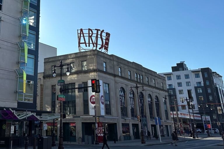 The Arts Bank building is shown on the corner of a busy intersection