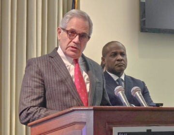 Larry Krasner speaking at a podium