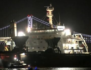 Cargo ship stuck in the river at night