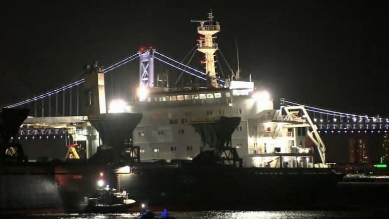 Cargo ship stuck in the river at night