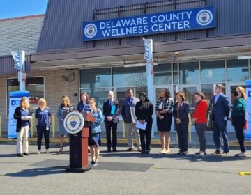 officials hold a press conference in front of the Delaware County Wellness Center