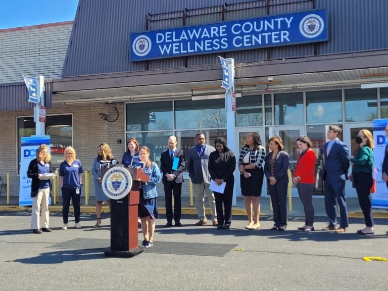 officials hold a press conference in front of the Delaware County Wellness Center