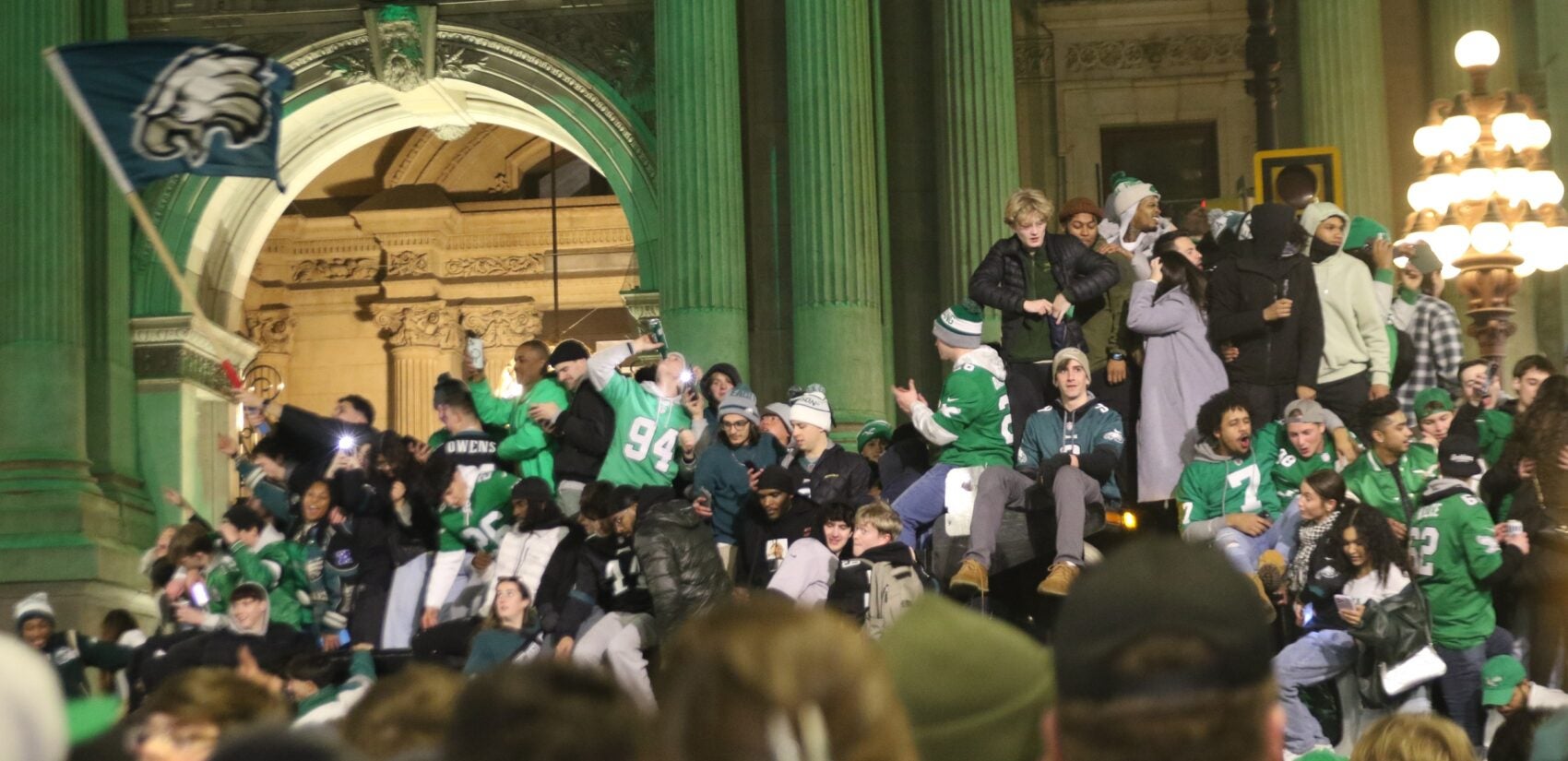 Many fans on top of trash trucks