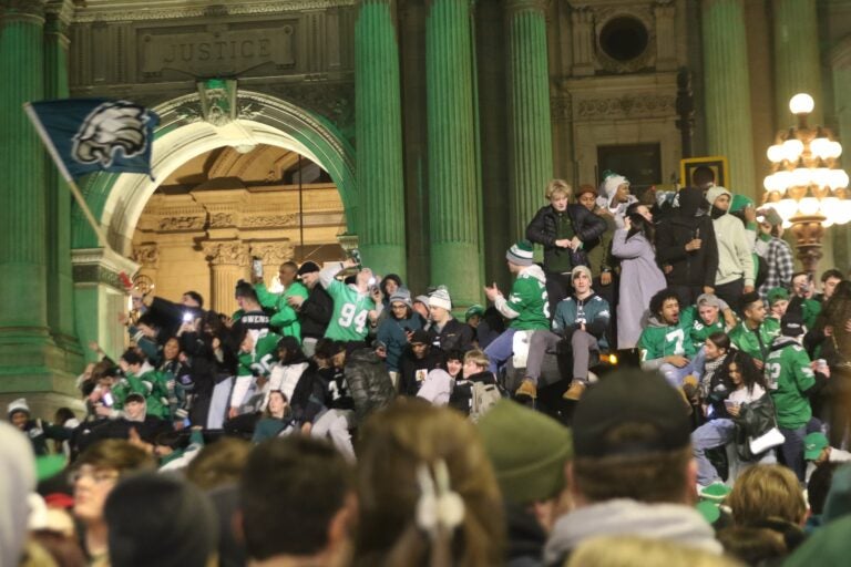 Many fans on top of trash trucks