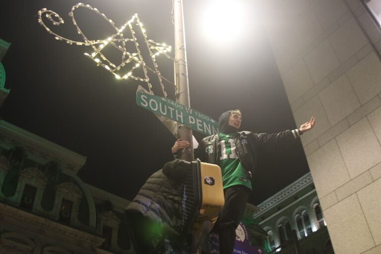 Two fans on a pole with a South Penn sign