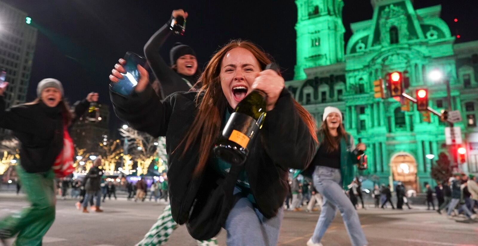 Philadelphia Eagles fans celebrate on South Broad Street in Philadelphia, Sunday Jan. 26, 2025, after the Eagles won the NFC Championship by defeating the Washington Commanders.