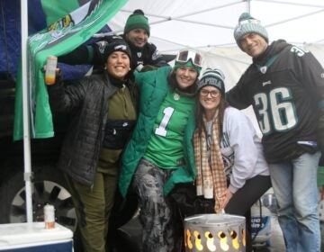 Five Eagles fans smile for a picture