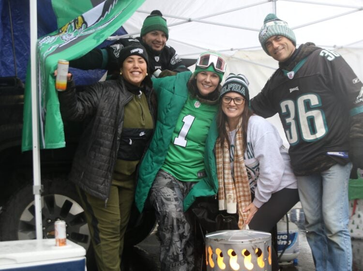 Five Eagles fans smile for a picture