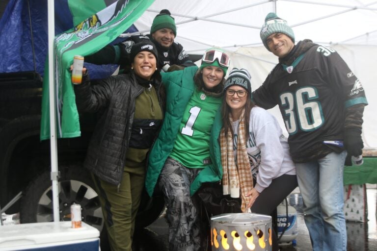 Five Eagles fans smile for a picture