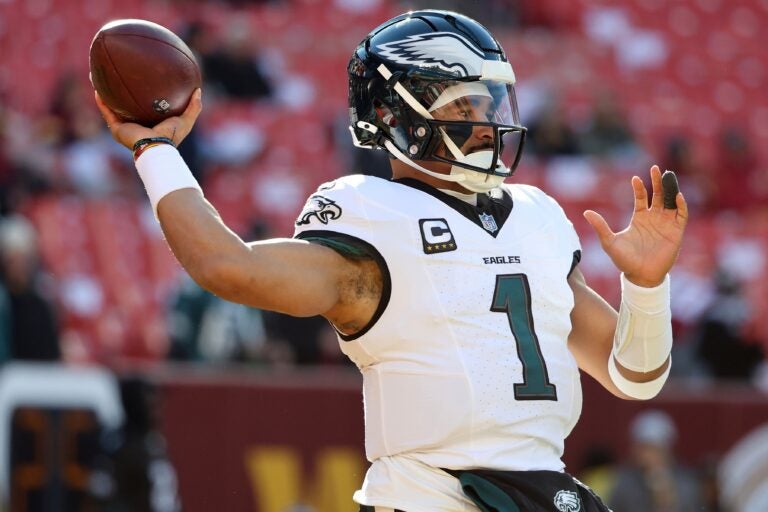 Jalen Hurts throws a ball