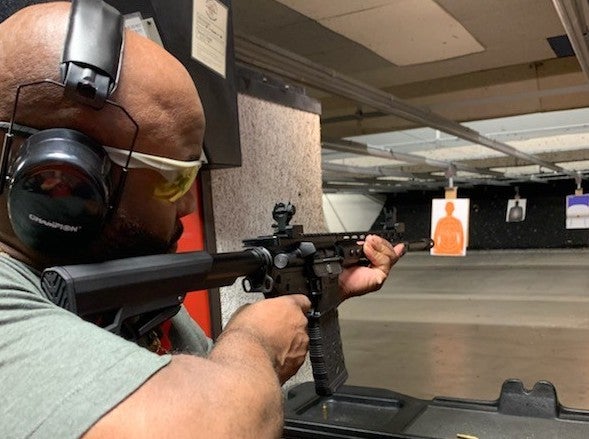 Joe Brake shooting a gun in a range