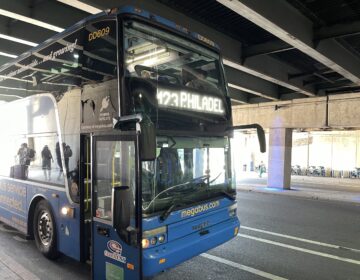 Megabus parked under a bridge