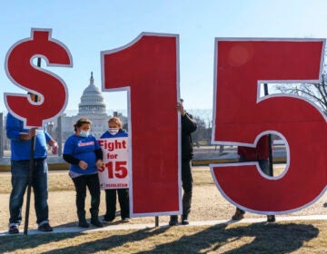 Activists appeal for a $15 minimum wage near the Capitol in Washington in 2021. (J. Scott Applewhite/AP)