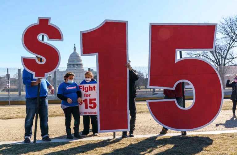 Activists appeal for a $15 minimum wage near the Capitol in Washington in 2021. (J. Scott Applewhite/AP)