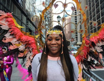 A member of Kaos Mas band poses for a photo. Tony Payne, CEO of Kaos Mas, said Caribbean Carnival is similar in many ways to the Mummers Parade, and there is a lot of overlap between the two traditions. (Emily Neil/WHYY)