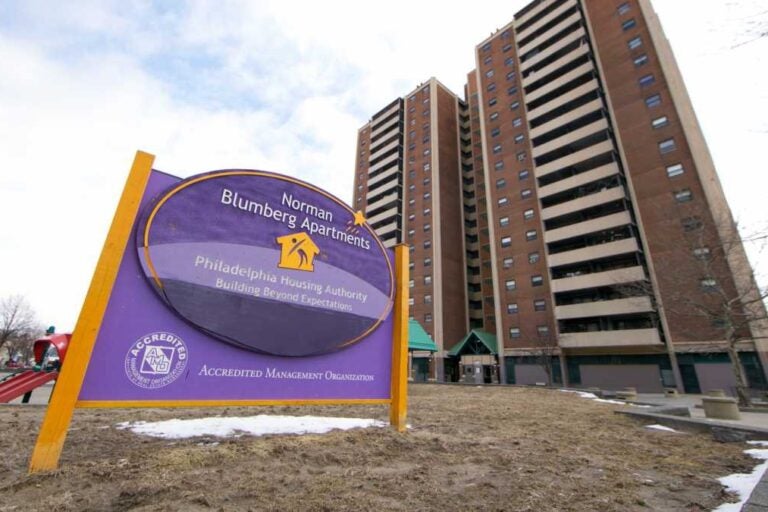 a sign for the Norman Blumberg Apartments