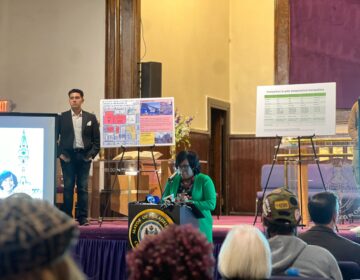 Mayor Parker speaking at a podium in a church