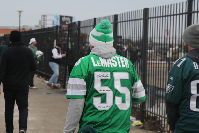 An Eagles fan with a signed LeMaster jersey