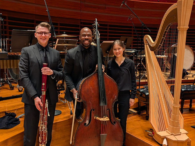 Oleksandr Kashlyuk, Joseph Conyers and Maya Lindsey smile with their instruments