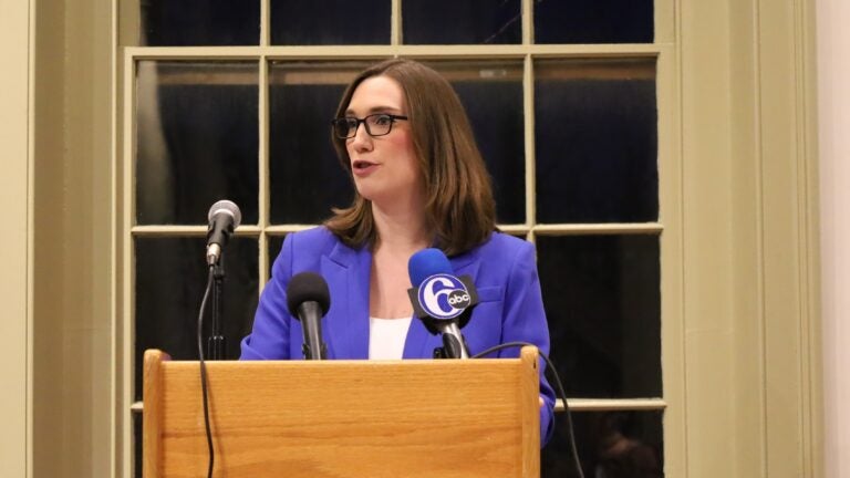 Sarah McBride speaks behind a podium