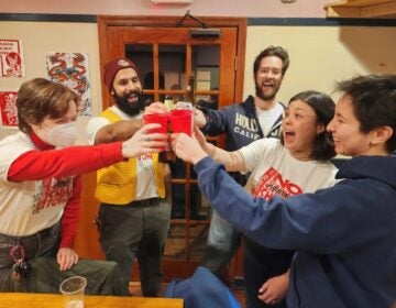 Ray Coyne, Jonathan Varghese, Louiis Taylor, Annabelle Schmitt, and Lauren Lowe smile and cheers