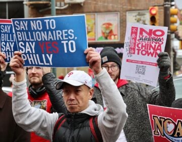 Arena opponents gather and hold signs reading NO ARENA IN CHINATOWN and SAY NO TO BILLIONAIRES, SAY YES TO PHILLY