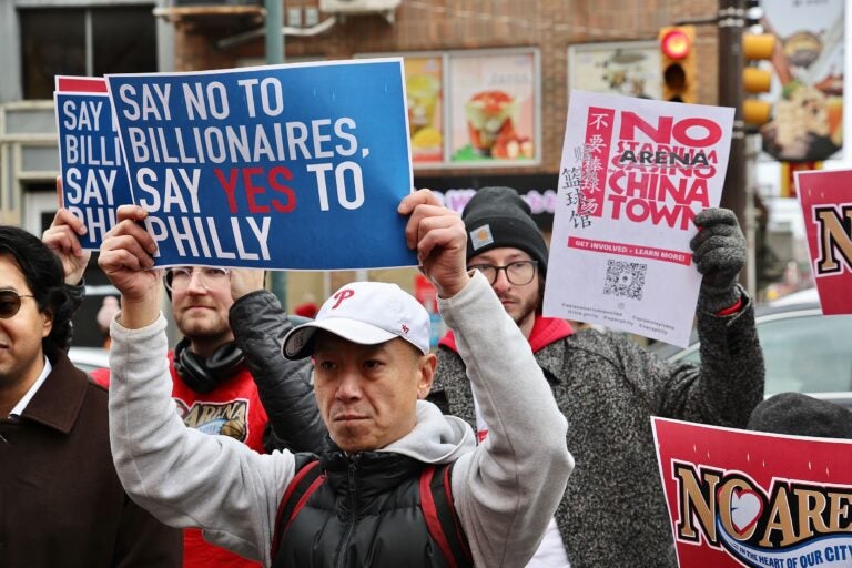 Arena opponents gather and hold signs reading NO ARENA IN CHINATOWN and SAY NO TO BILLIONAIRES, SAY YES TO PHILLY