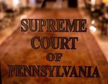 A sign on a door reads SUPREME COURT OF PENNSYLVANIA