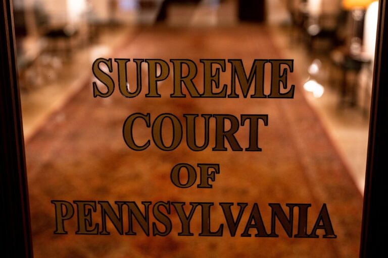 A sign on a door reads SUPREME COURT OF PENNSYLVANIA